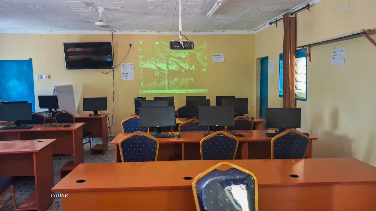 County High School ICT laboratory with projector and computer workstations